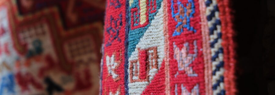 Close up of a Persian rug with traditional patterns